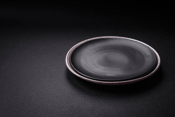 istock Empty round ceramic plate as an item of kitchen utensils 1839533943