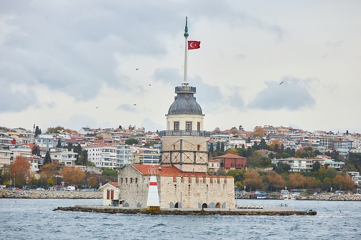 ISTANBUL, TURKEY - NOVEMBER 23, 2021: The famous Maiden Tower (Kiz kulesi) in the Bosphorus Strait in Istanbul.