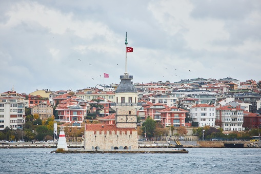 ISTANBUL, TURKEY - NOVEMBER 23, 2021: The famous Maiden Tower (Kiz kulesi) in the Bosphorus Strait in Istanbul.