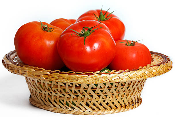 istock Many tomatoes in a straw basket 183954033