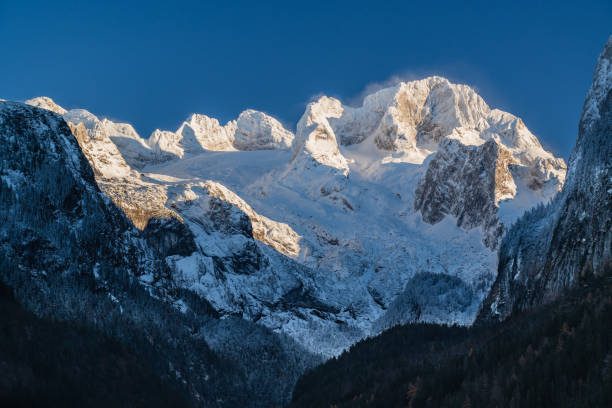 istock Dachstein mountain in Austria with snow and clear blue sky 1839541360