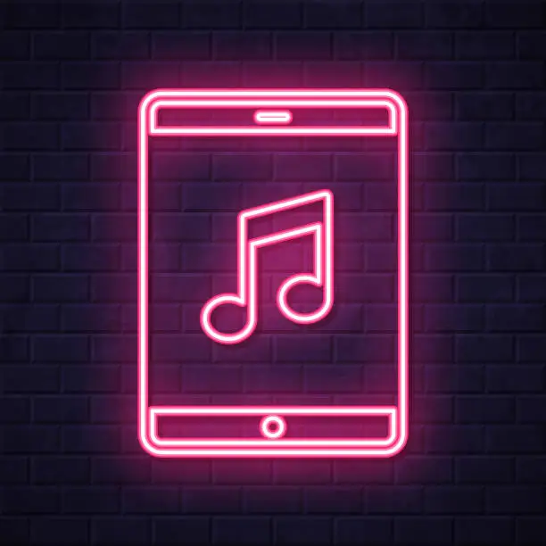 Vector illustration of Music on tablet PC. Glowing neon icon on brick wall background