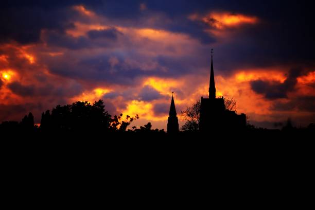 Dramatic evening cloudscape over Hannover with church silhouette.