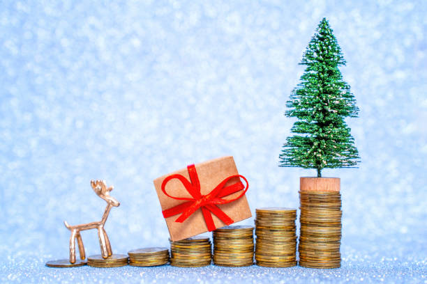 istock Festive Steps: Coin Stacks with Toy Tree and Deer 1839593044