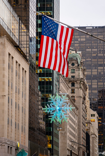 Huge snowflake hang on a street in New York, USA