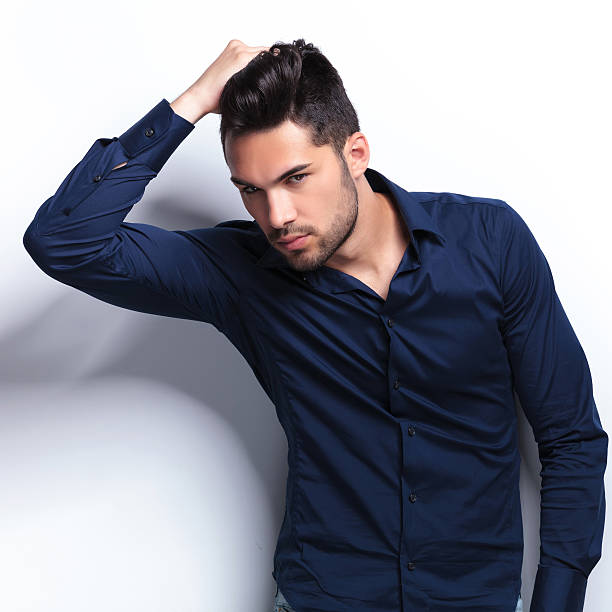 istock young man adjusting his hair 183960835
