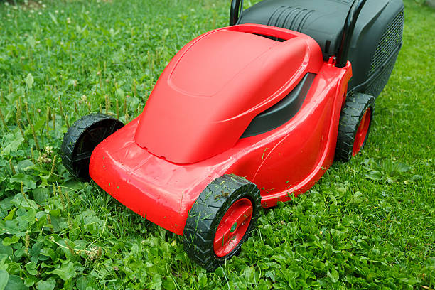 istock new lawnmower on green grass 183961086