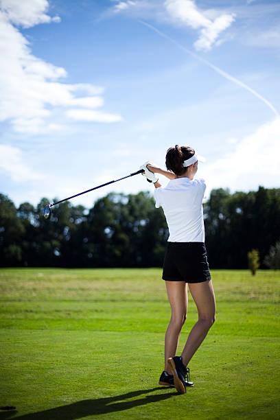 istock Girl playing golf on grass in summer 183961387