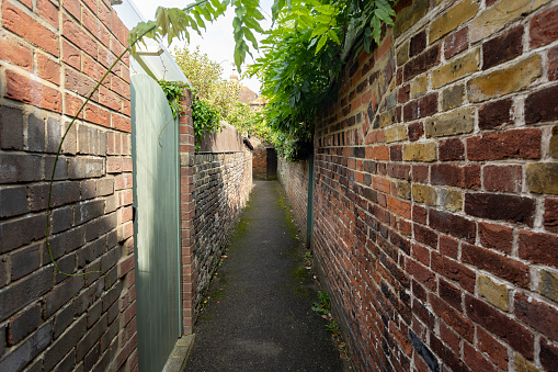 View of a Long Dark Alley in an Inner City District