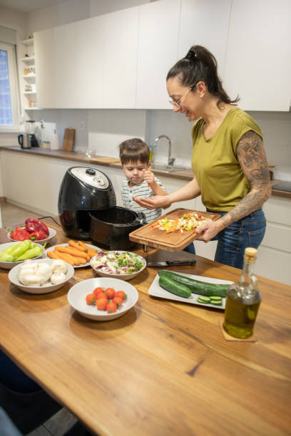 istock Woman and her little son making a lunch 1839643923