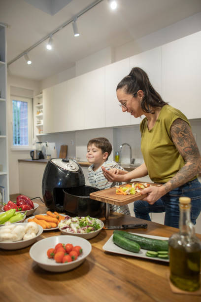 istock Happy little boy having fun while cooking with mom 1839643928