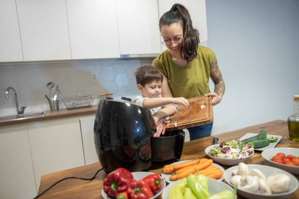 istock Four years old boy and his mom cooking together 1839643940