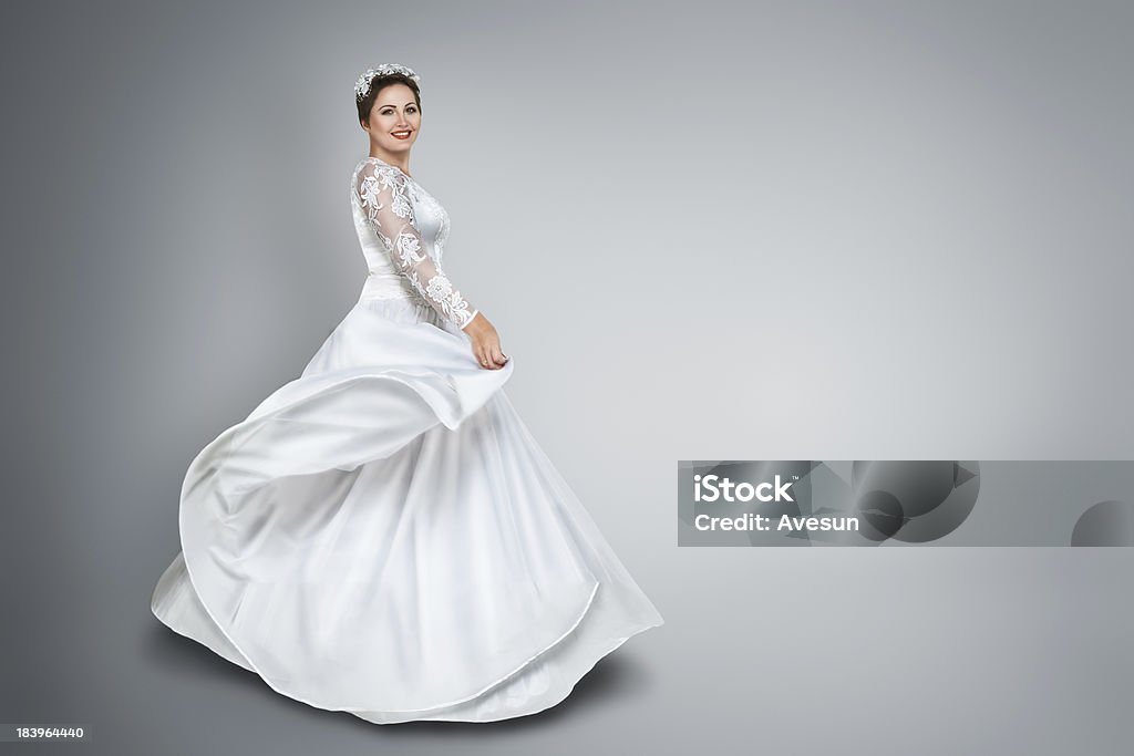 Bride in beautiful wedding dress Happy young bride in beautiful long wedding dress 30-39 Years Stock Photo