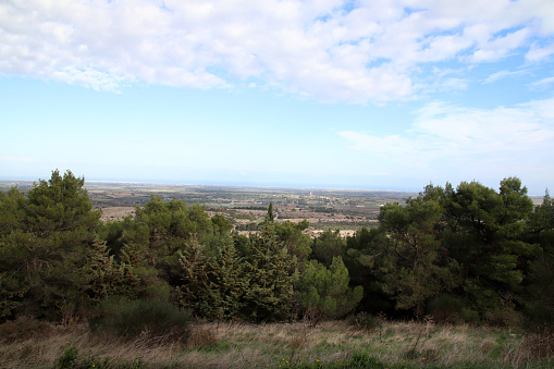 Castel del Monte, Province of Barletta-Andria-Trani, Italy - 3 december 2023: panorama from the hill of Castel del Monte: you can glimpse the Murgia landscape and the coastal towns.