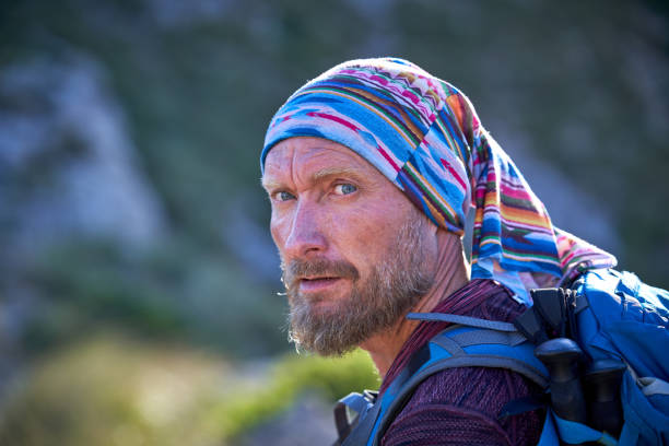 istock Mature traveling man looking away in nature 1839656969