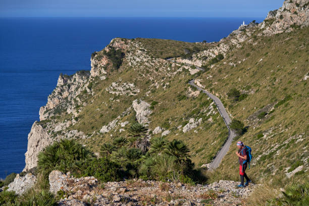 istock Traveler walking along rocky cliff 1839657485
