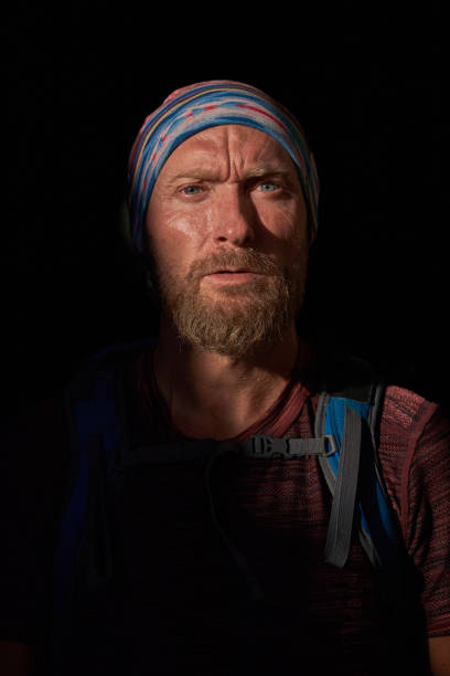 istock Serious middle aged male hiker in dark room 1839657489