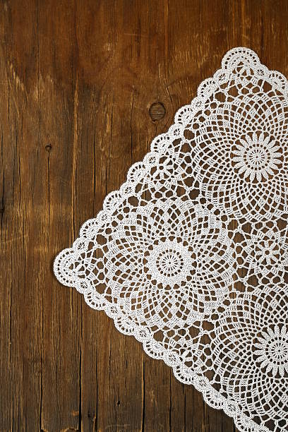 istock wooden background with white lace vintage napkin 183967155