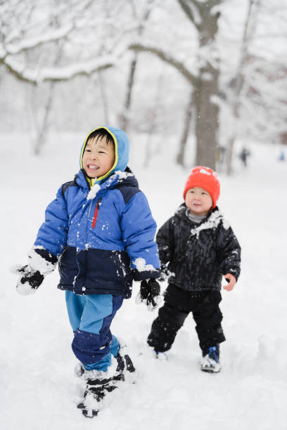 Portrait of Italian boy with winter clothing in the mountains in winter