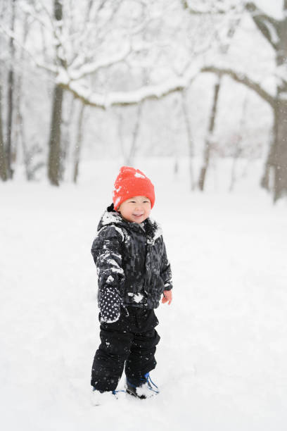 istock Sweet siblings having fun in snowy forest 1839732922