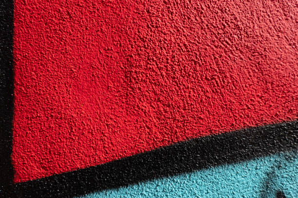 Abstract wall surface with part of graffiti. Geometric lines, light blue, black, red colors background.
