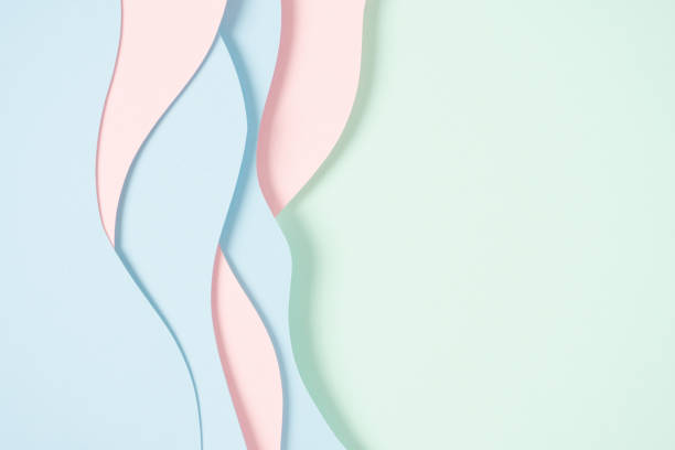 istock Abstract colored paper texture background. Minimal paper cut composition with layers of geometric shapes and lines in pastel green, pink and light blue colors. Top view, copy space 1839742019