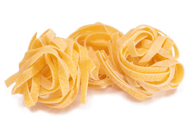 istock Three Classic Italian Raw Egg Fettuccine - Isolated on White Background 1839777582