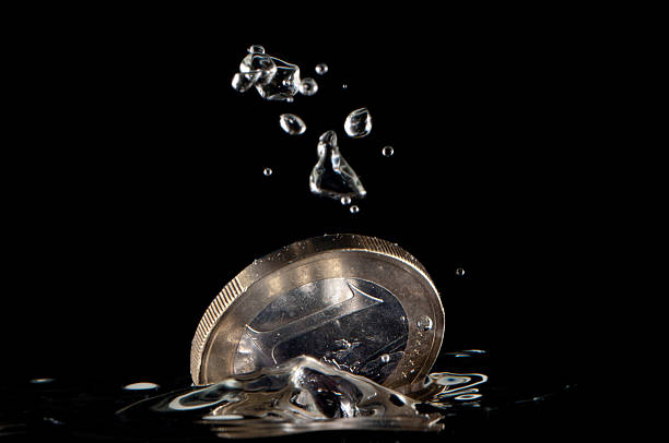 istock Splashing euro coin 183979115