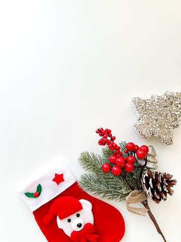 Christmas composition. Gifts, fir branches, holiday decorations on a white background. Christmas, winter, new year concept. Flat image, top view, copy space