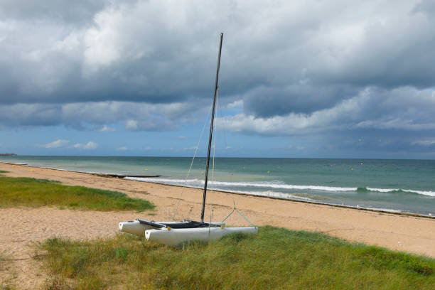 Mers-les-Bains, France - July 10, 2022: A sailboat sailing in the atlantic in France on a sunny day