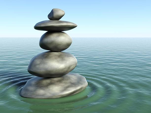 istock 3d Zen stones in a water 183980412