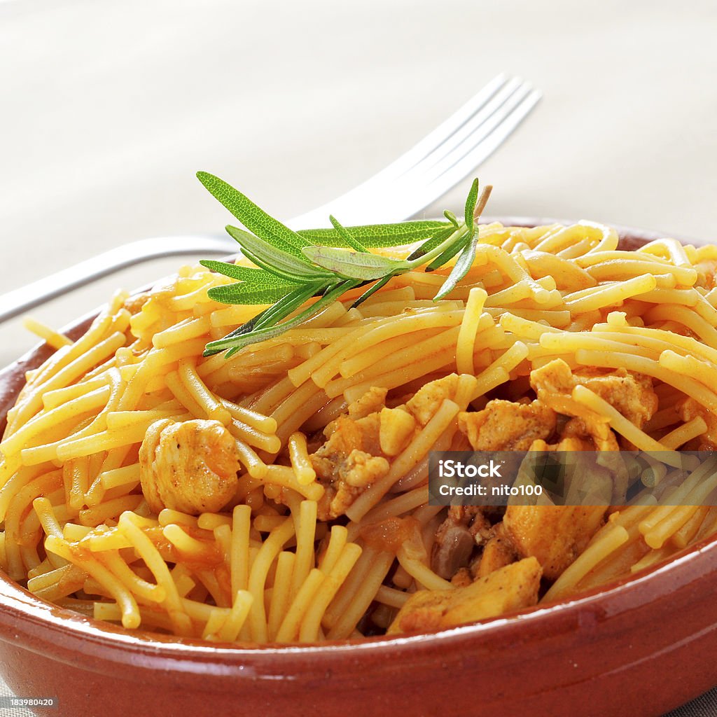 spanish noodles with chicken closeup of an earthenware bowl with spanish noodles with chicken Buffet Stock Photo