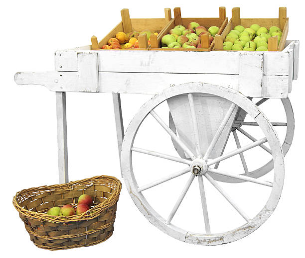 Cart with apples Old wooden cart with apples isolated on white background fruit cart vendor stock pictures, royalty-free photos & images