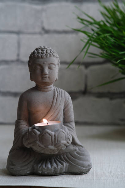 istock a small stone statue of Buddha 1839827106