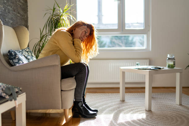 istock Sad depressed woman alone at home. 1839863889