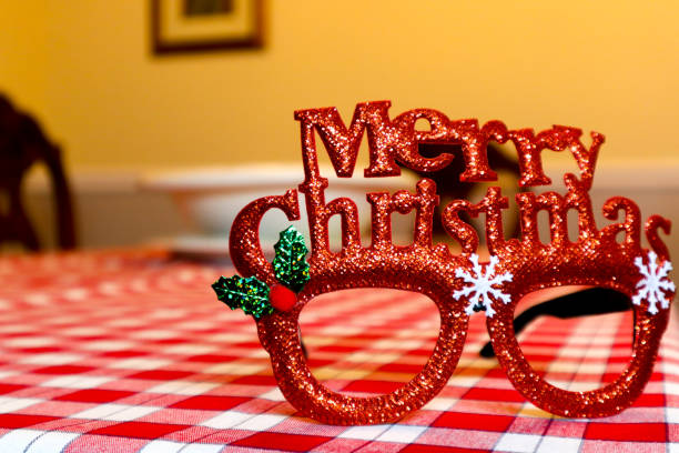 Close up shot of Christmas glasses on red table cloth