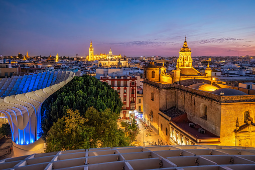 October 20, 2021 - Sevilla, Spain: Seville skyline in the Old Quarter at dusk from the Setas of Sevilla and La Giralda illuminated in the background .Spain