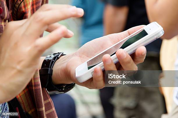 Teenage Girl Text Messaging On Her Phone Stock Photo - Download Image Now - Holding Hands, Mobile Phone, Teenager