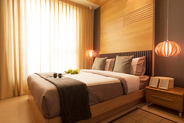 istock Modern luxurious bedroom with a king size bed and two lights 183992368