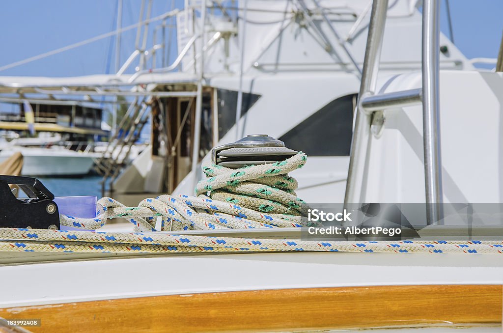 Winch and Ropes on a Sailing Boat Detail of a Winch with ropes on sailing boat Cable Winch Stock Photo