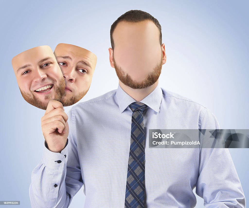 happy and sad mask young man holding happy and sad mask Hiding Stock Photo