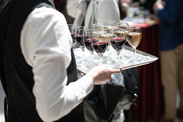 istock waiter serving wine at party 1839933034