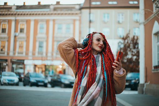 woman enjoys music on the street