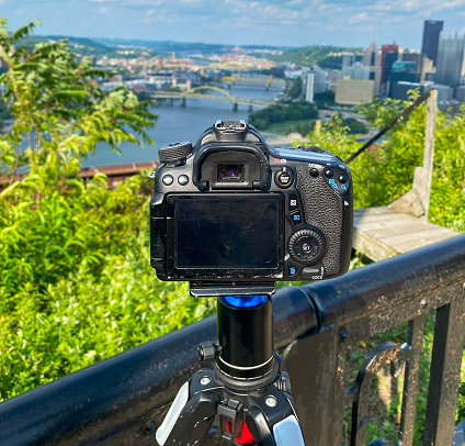 Pittsburgh, Pennsylvania, USA - 4 August 2023: A camera on a tripod Capturing a Stunning Pittsburgh Landscape from atop Mount Washington.