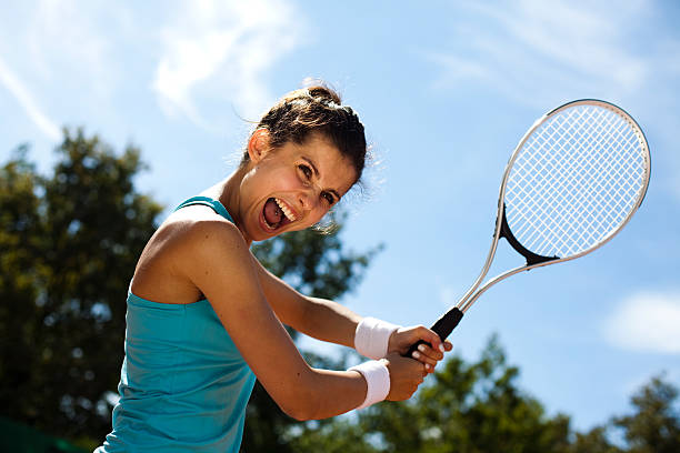 istock Woman playing tennis in summer 183995527