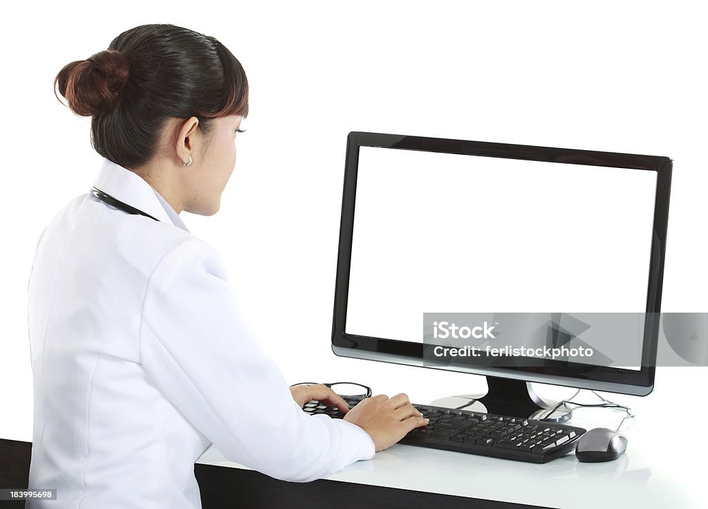medical doctor woman with computer medical doctor woman working with computer. Isolated over white background Typing Stock Photo