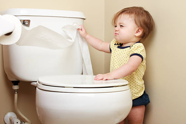 istock Baby pulling toilet paper off the roll 183999164