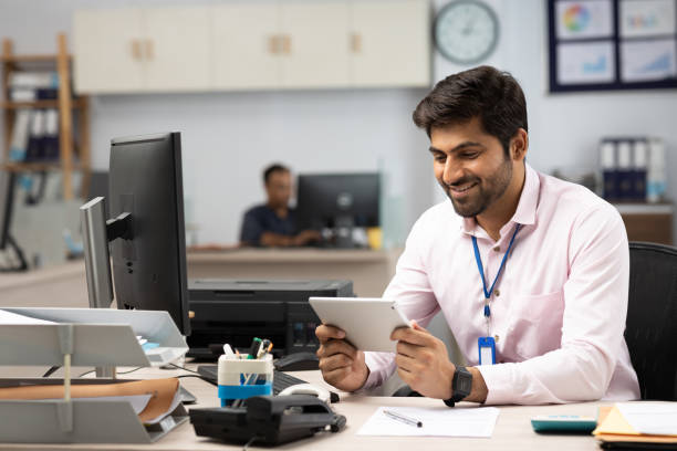 istock Young Business Person Using Computer in Bank Stock Photo 1839997809