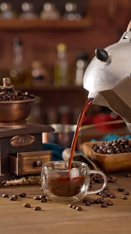 Man hand pouring coffee from a geyser coffee maker