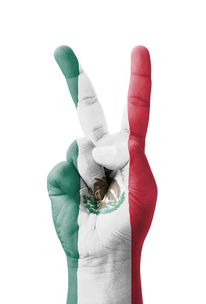 istock Hand making the V sign, Mexico flag painted 184002791